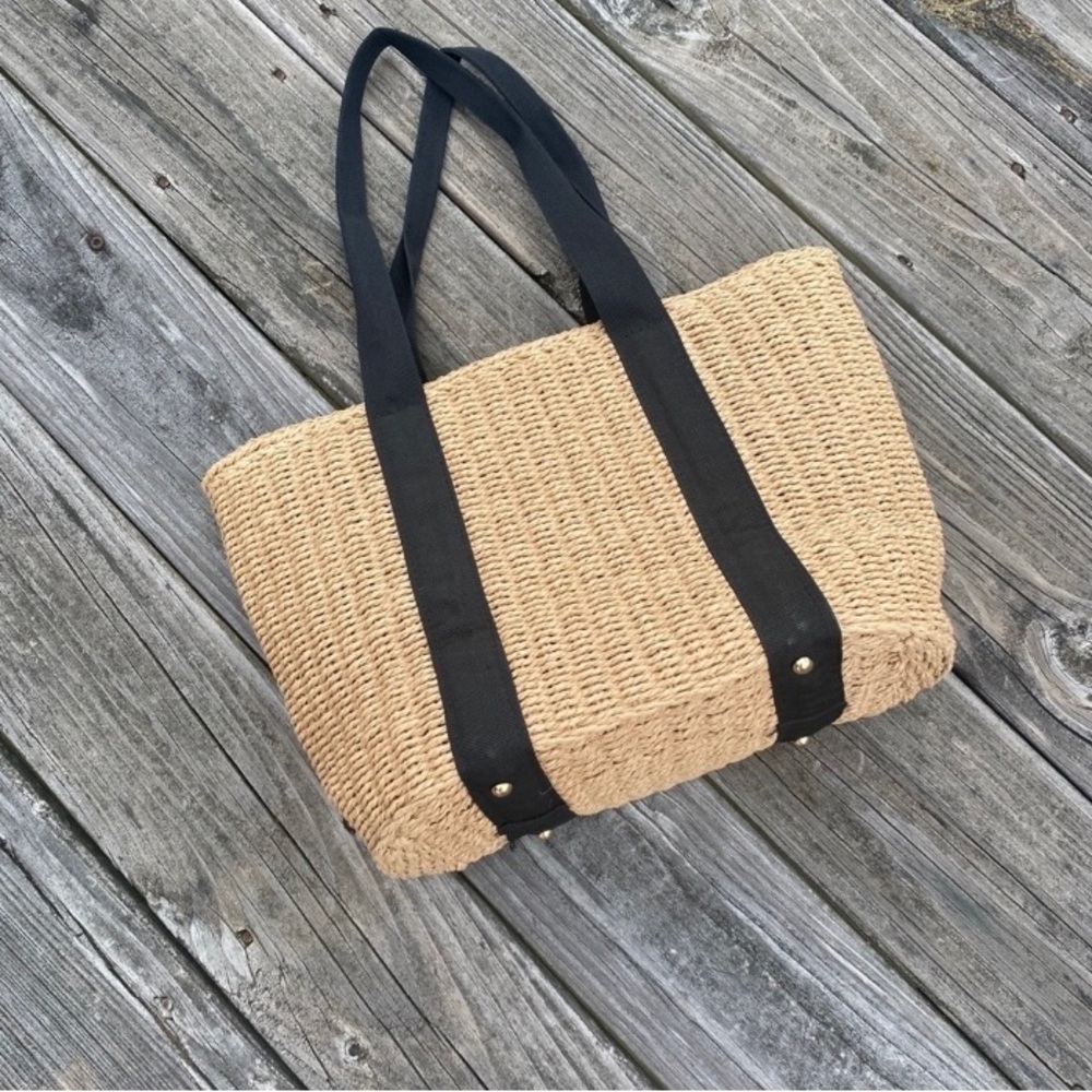 Straw bag with black drawstring interior